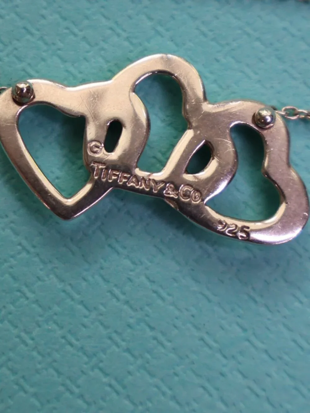 Tiffany & Co. Three Hearts Pendant on 16